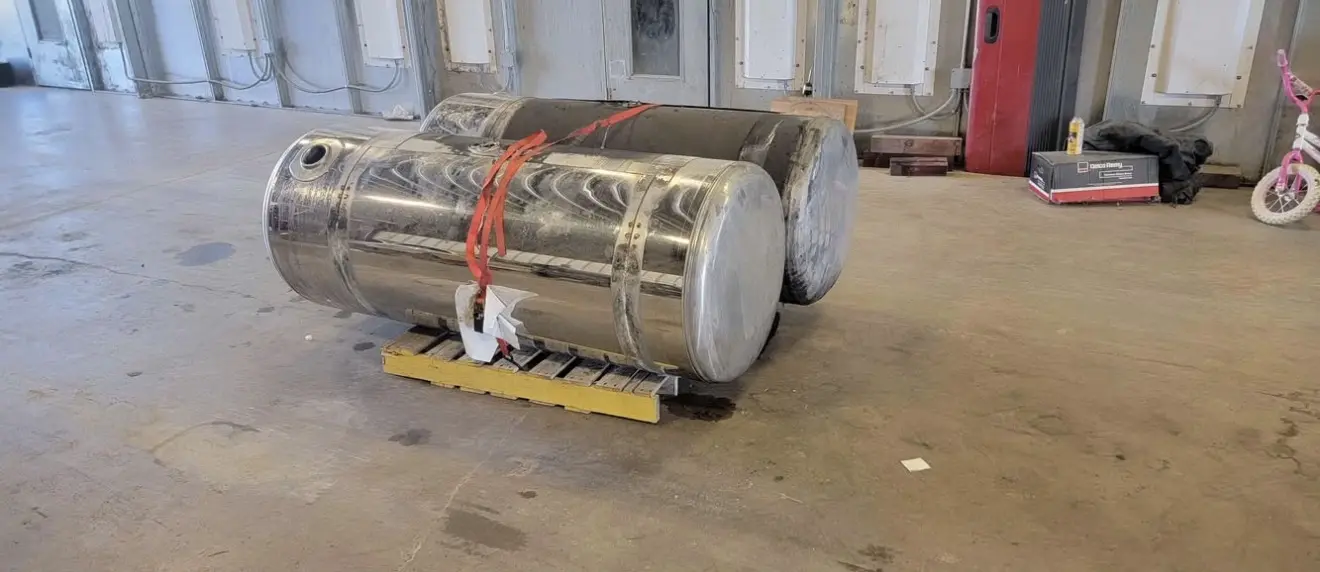 177195121179093.webp 26” x 140 gallon stainless wrapped fuel tanks - Image 1